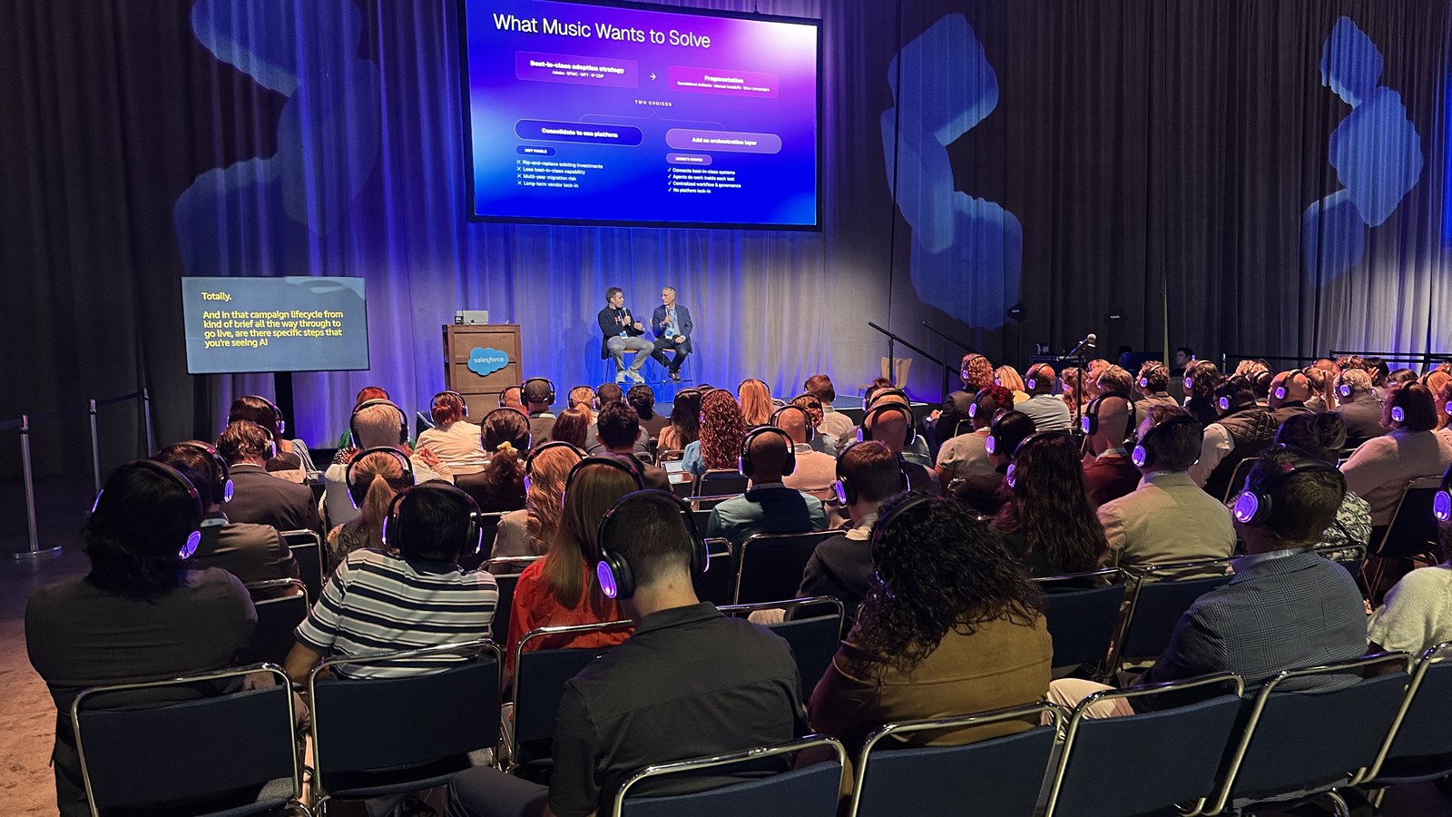 Audience watching two speakers at Salesforce Connections 2026