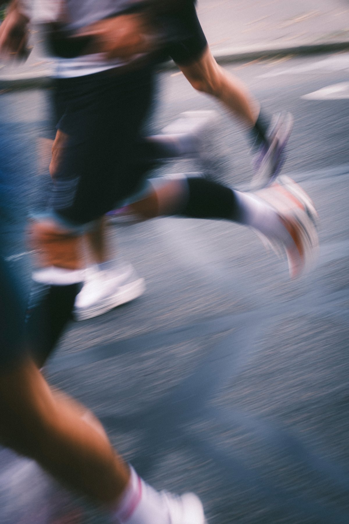 Runner in motion on a city street